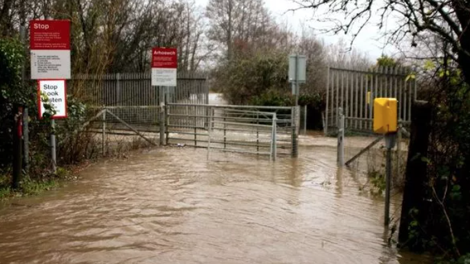 Why do Natural Resources Wales and the Welsh Government still allow local authorities to build on floodplains?