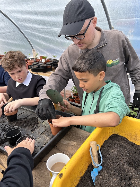Fruits of labour: Local school children join forces with community gardens for National Garden Week to support the old and vulnerable.