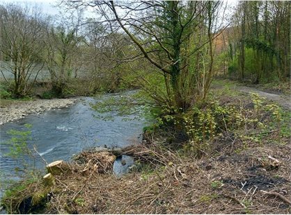 Wall and riverbank repairs on former tip site in Penrhiwceiber